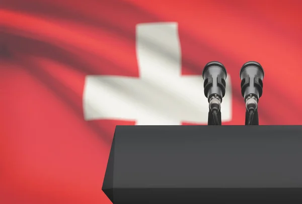 Pulpito e due microfoni con una bandiera nazionale su priorità bassa - Svizzera — Foto Stock