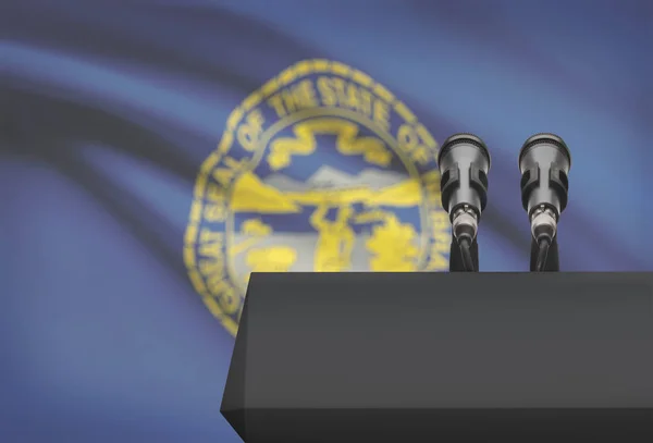 Ambona i dwa mikrofony z Usa stan flagi na tle - Nebraska — Zdjęcie stockowe
