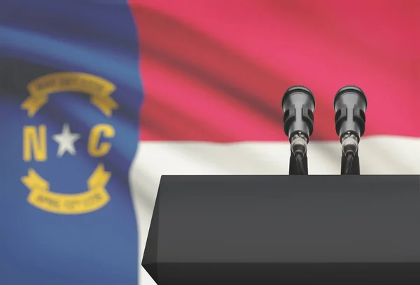 Pulpit and two microphones with USA state flag on background - North Carolina — Stock Photo, Image