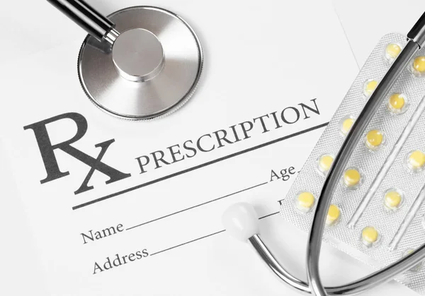 Medical ideas - prescription form with stethoscope over it — Stock Photo, Image