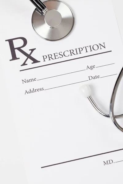Medicine, healthcare and all things related - prescription form with stethoscope over it — Stock Photo, Image