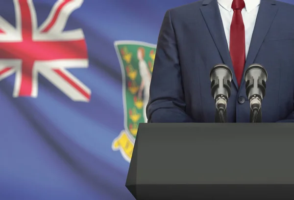 Biznesmen i polityk, Dokonywanie mowy zza ambony z flagi narodowej na tle - Brytyjskie Wyspy Dziewicze — Zdjęcie stockowe