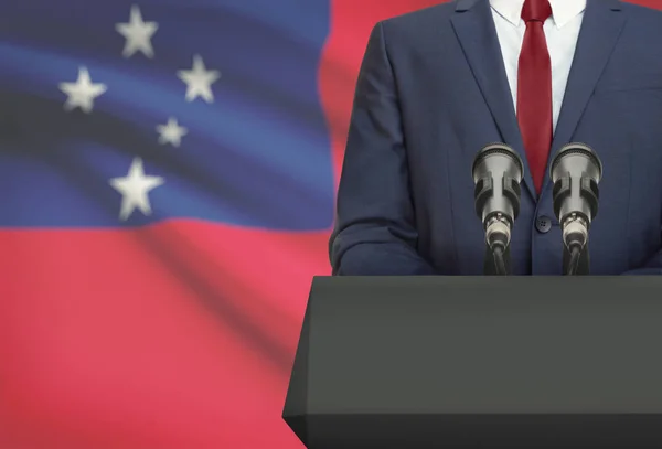 Businessman or politician making speech from behind a pulpit with national flag on background - Samoa — Stock Photo, Image