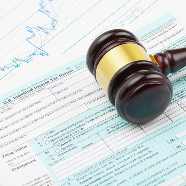 Business world and its symbols - wooden judge's gavel over 1040 USA Tax Form — Stock Photo, Image