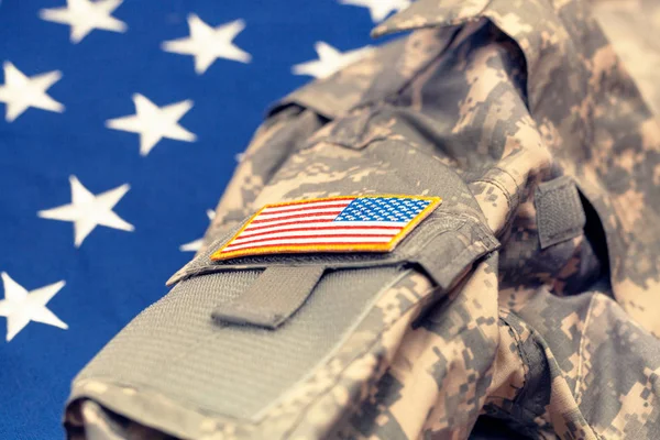 USA army uniform over national flag - studio shot. Filtered image: cross processed vintage effect. — Stock Photo, Image