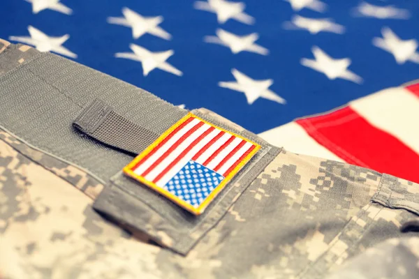 USA flag with army uniform - close up studio shot. Filtered image: cross processed vintage effect. — Stock Photo, Image