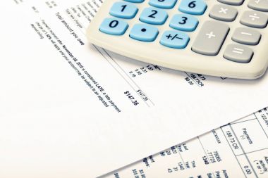 Hesap makinesi yanında yardımcı programı'nı bill. Filtre uygulanan görüntü: çapraz işlenen vintage etkisi.