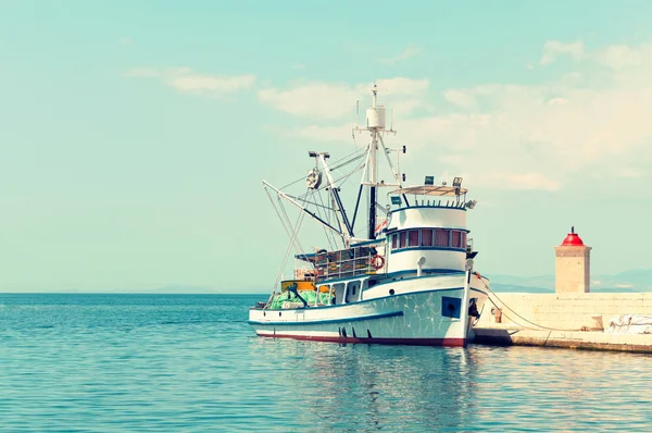 Fishing trawler in the harbor of a small town at a daytime - Cro — Stock Photo, Image