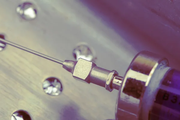 Vintage glass syringe with steel needle — Stock Photo, Image