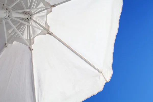 White sunshade on th background of blue sky — Stock Photo, Image