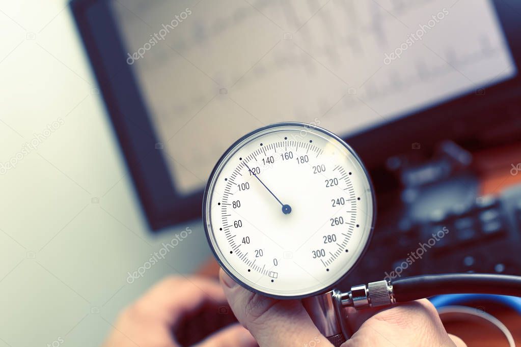 Blood pressure monitor in doctors hand