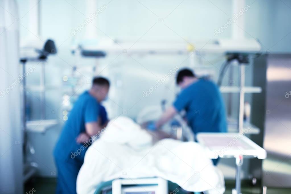 Professional life rescue in hospital, unfocused background