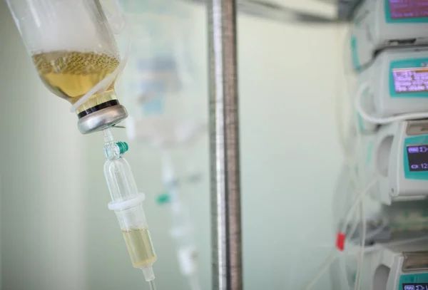 Medical solution bottle hanging on the rack — Stock Photo, Image