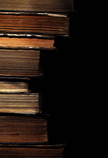 Rare books stacked isolated on black background — Stock Photo, Image