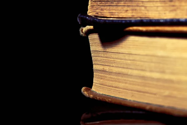 Pile of old books isolated on black — Stock Photo, Image