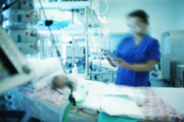 Female doctor working with comatose baby in the intensive care u — Stock Photo, Image