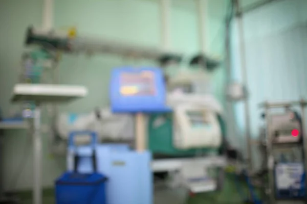 Hospital room with life support equipment, unfocused background
