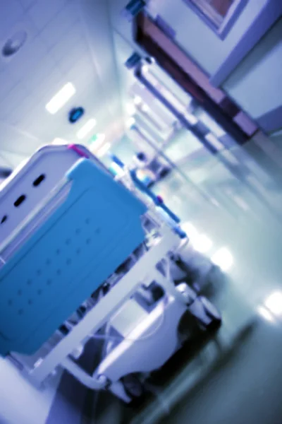 Modern wheelbed in the long hospital foyer, unfocused background — Stock Photo, Image