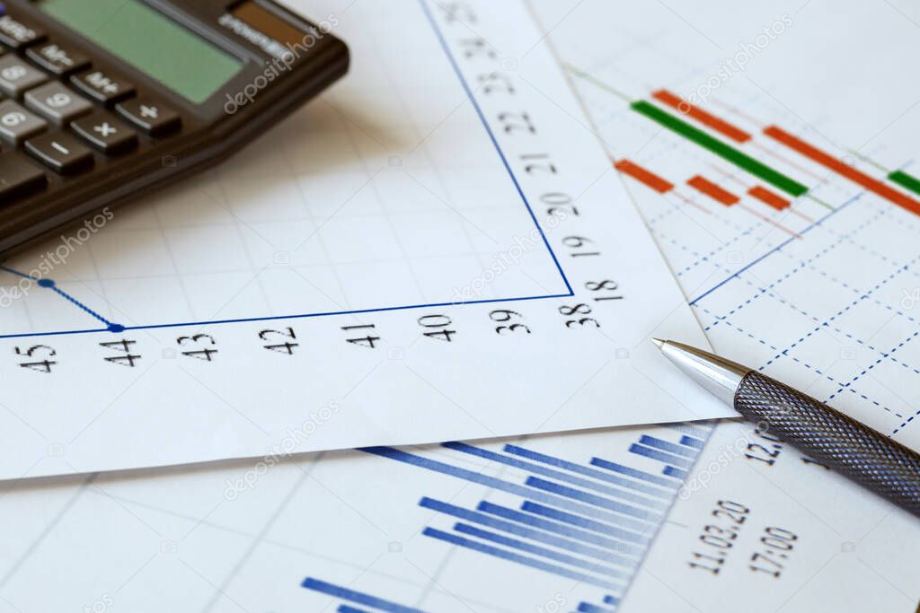 charts, calculator and pen as concept stock analytics, statistics for planning, financial instruments and banking crisis
