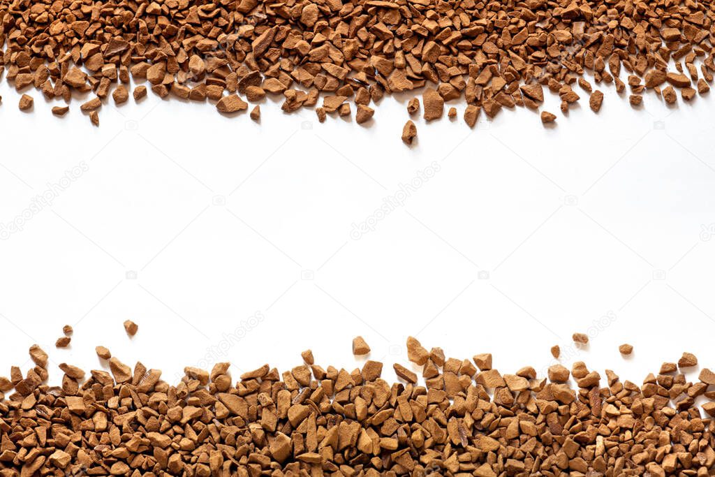 golden color freeze dried coffee, instant coffee granules on a white background close-up, Sublimated coffee texture, free space, place for text in the center