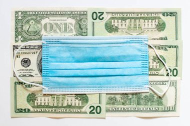 Dolar banknotlarındaki koruyucu maske, krizle mücadele ödemeleri, düşük faiz oranları, devletin iş için verdiği destek, koronavirüs yüzünden ekonomiye zarar