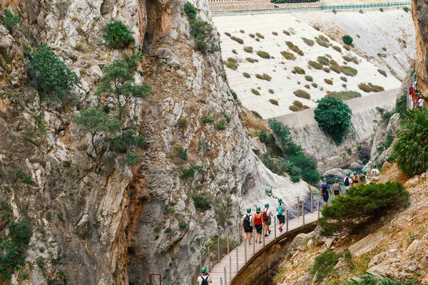 Brown red mountains shale steep cliffs near the trail, mountain trail along steep cliffs in Spain, Ardales the caminito caminito del rey. Tall red rocks mountain side in el Chorro