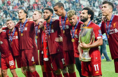 Istanbul, Turkey - August 14, 2019: Mohamed Salah celebrate victory with Liverpool  team and holdind trophy the UEFA Super Cup in Vodafone Arena, Turkey