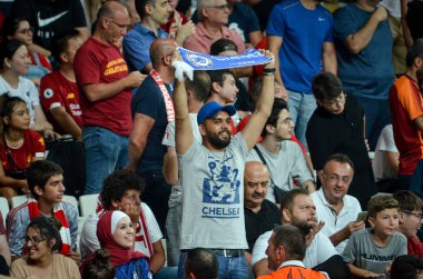 Istanbul, Turkey - August 14, 2019: Chelsea Football fans and spectators celebrate goal scored during the UEFA Super Cup Finals match between Liverpool and Chelse, Turkey