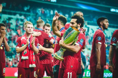 Istanbul, Turkey - August 14, 2019: Mohamed Salah celebrate victory with Liverpool  team and holdind trophy the UEFA Super Cup in Vodafone Arena, Turkey