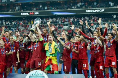 Istanbul, Turkey - August 14, 2019: Liverpool footballers celebrate victory at award ceremony during the UEFA Super Cup Finals match between Liverpool and Chelsea at Vodafone Park, Turkey