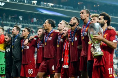 Istanbul, Turkey - August 14, 2019: Mohamed Salah celebrate victory with Liverpool  team and holdind trophy the UEFA Super Cup in Vodafone Arena, Turkey