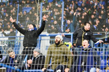 KHARKIV, UKRAINE - December 11, 2019: Atalanta Bergamasca Calcio BC fans and ultras support their team during the UEFA Champions League match, Ukraine