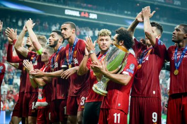 Istanbul, Turkey - August 14, 2019: Mohamed Salah celebrate victory with Liverpool  team and holdind trophy the UEFA Super Cup in Vodafone Arena, Turkey