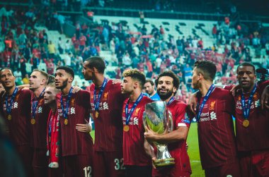 Istanbul, Turkey - August 14, 2019: Mohamed Salah celebrate victory with Liverpool  team and holdind trophy the UEFA Super Cup in Vodafone Arena, Turkey