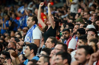 Istanbul, Turkey - August 14, 2019: Chelsea Football fans support the team during the UEFA Super Cup Finals match between Liverpool and Chelsea at Vodafone Park, Turkey