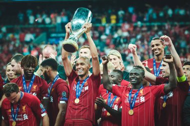Istanbul, Turkey - August 14, 2019: Liverpool footballers celebrate victory at award ceremony during the UEFA Super Cup Finals match between Liverpool and Chelsea at Vodafone Park, Turkey