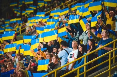 DNIPRO, UKRAINE - September 10, 2019: Ukrainian fans and spectators support team on the stadium player during the friendly match between national team Ukraine against Nigeria, Ukraine