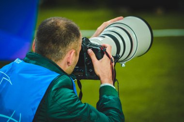 KHARKIV, UKRAINE - September 18, 2019: Journalists and photographers with a camera make report during the UEFA Champions League match, Ukraine