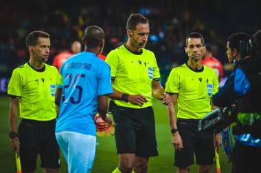 KHARKIV, UKRAINE - September 18, 2019: Referee Artur Soares Dias and Fernandinho during the UEFA Champions League match between Shakhtar vs Manchester City, Ukraine
