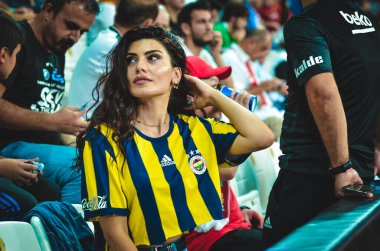 Istanbul, Turkey - August 14, 2019: Fan girl Galatasaray supports the team during the UEFA Super Cup Finals match between Liverpool and Chelsea at Vodafone Park in Vodafon Arena, Turkey