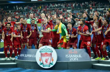 Istanbul, Turkey - August 14, 2019: Liverpool footballers celebrate victory at award ceremony during the UEFA Super Cup Finals match between Liverpool and Chelsea at Vodafone Park, Turkey