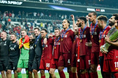 Istanbul, Turkey - August 14, 2019: Mohamed Salah celebrate victory with Liverpool  team and holdind trophy the UEFA Super Cup in Vodafone Arena, Turkey