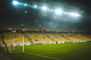 LVIV, UKRAINE - November 07, 2019: Night football stadium with light close up and general view during the UEFA Europa League match between Alexandria vs AS Saint Etienne (France), Ukraine