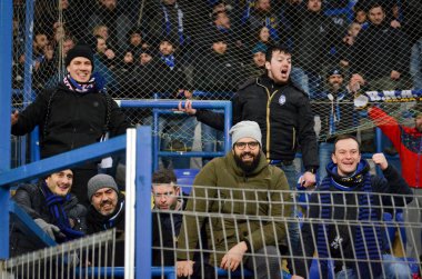 KHARKIV, UKRAINE - December 11, 2019: Atalanta Bergamasca Calcio BC fans and ultras support their team during the UEFA Champions League match, Ukraine