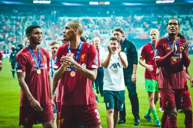 Istanbul, Turkey - August 14, 2019: Liverpool footballers celebrate victory at award ceremony during the UEFA Super Cup Finals match between Liverpool and Chelsea at Vodafone Park, Turkey