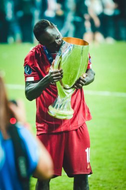 Istanbul, Turkey - August 14, 2019: Sadio Mane celebrates victory holding in his hands UEFA Super Cup after the match between Liverpool and Chelsea at Vodafone Park in Vodafone Arena, Turkey