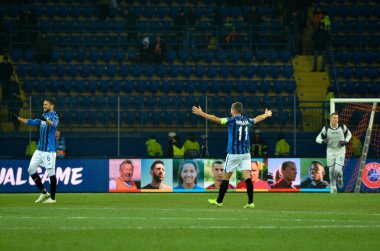 KHARKIV, UKRAINE - December 11, 2019: Atalanta player celebrate their team getting to the next round of the 1/8 finals Champions League, Ukraine