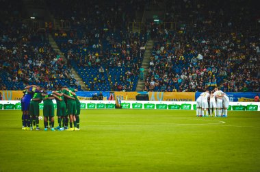 DNIPRO, UKRAINE - September 10, 2019: Nigeria national team starting lineup cuddling during the friendly match between national team Ukraine against Nigeria national team, Ukraine