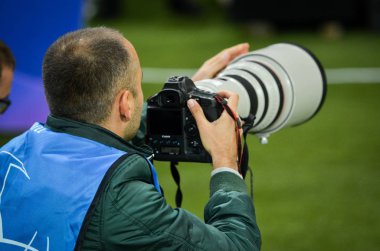 KHARKIV, UKRAINE - September 18, 2019: Journalists and photographers with a camera make report during the UEFA Champions League match, Ukraine