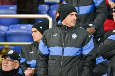 KHARKIV, UKRAINE - December 11, 2019: Youth Atalanta Football Players as spectators on the stadium, Ukraine